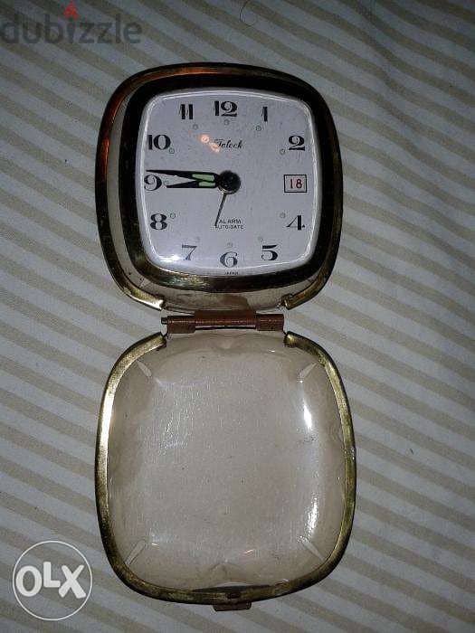 ساعة منبه صغير قديم تعبايه يتحول الى علبه صغيرة يعمل جيدا صنع اليابان 2