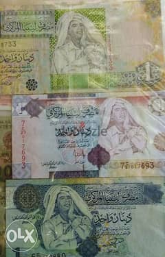 عملة ورقة دينار ليبيا عليها صورة القذافي 0