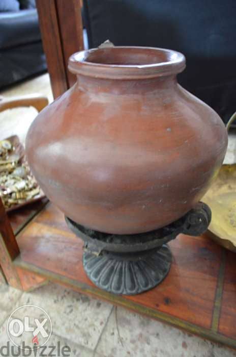 pottery jar with iron base 0