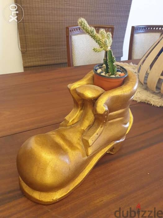 Golden Boot funky design made out of concrete and gyps. 1