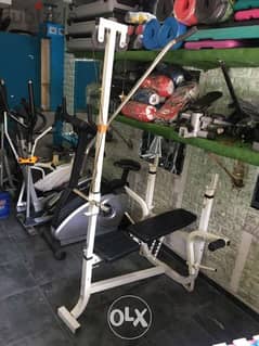 adjustable bench with cable and biceps and legs extention like new 0