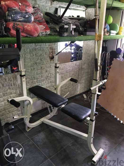 adjustable bench with cable and biceps and legs extention like new 1