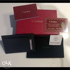 CARTIER (new in its gift bag) black genuine grained leather 0