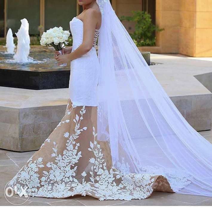 This swarovski wedding dress for sale b 1,500$ 2