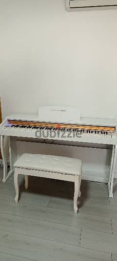 one week offer piano white glossy new in box with chair free