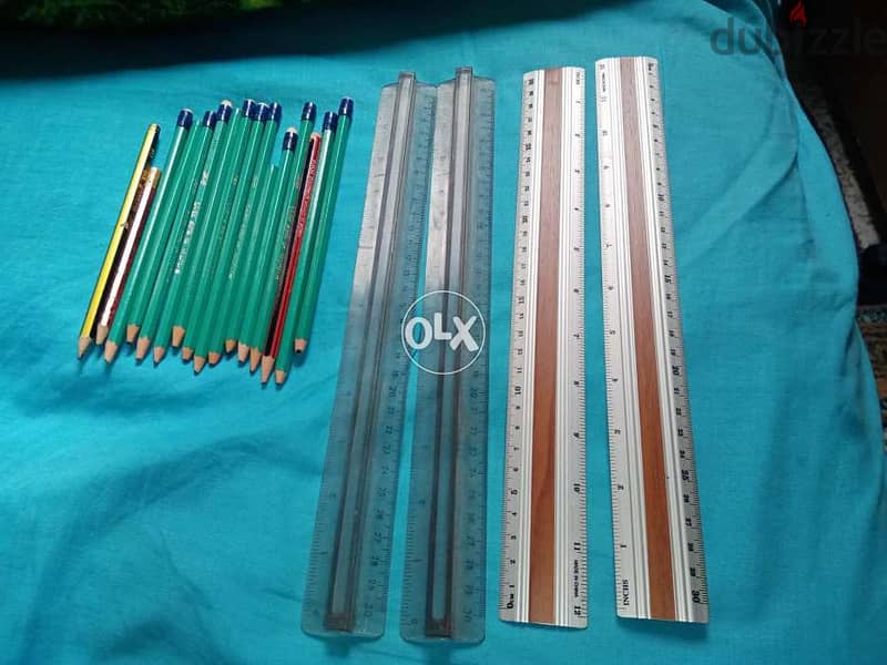 2 mechanical pencils and various pencils and rulers 3