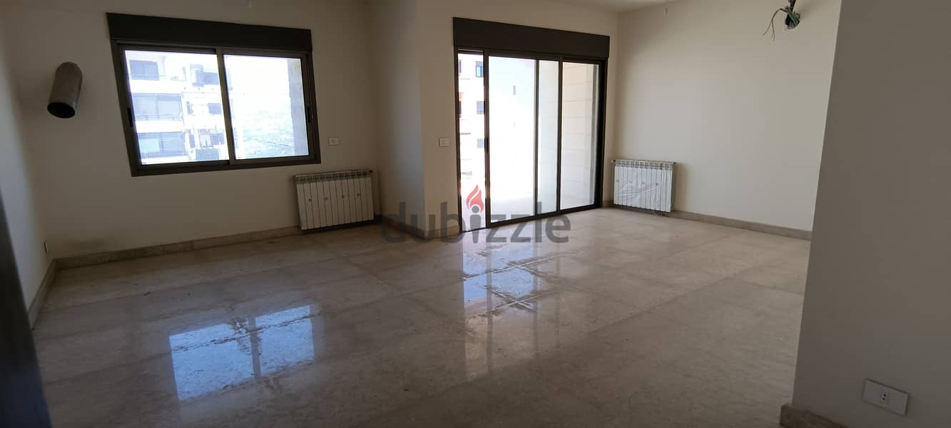 RWK138JS - Apartment For Sale in Ballouneh - شقة للبيع في بلونة 4