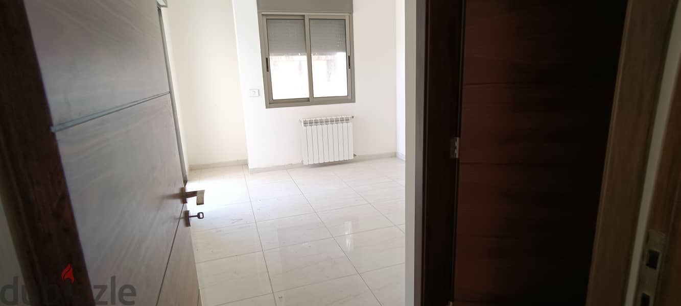RWK138JS - Apartment For Sale in Ballouneh - شقة للبيع في بلونة 7