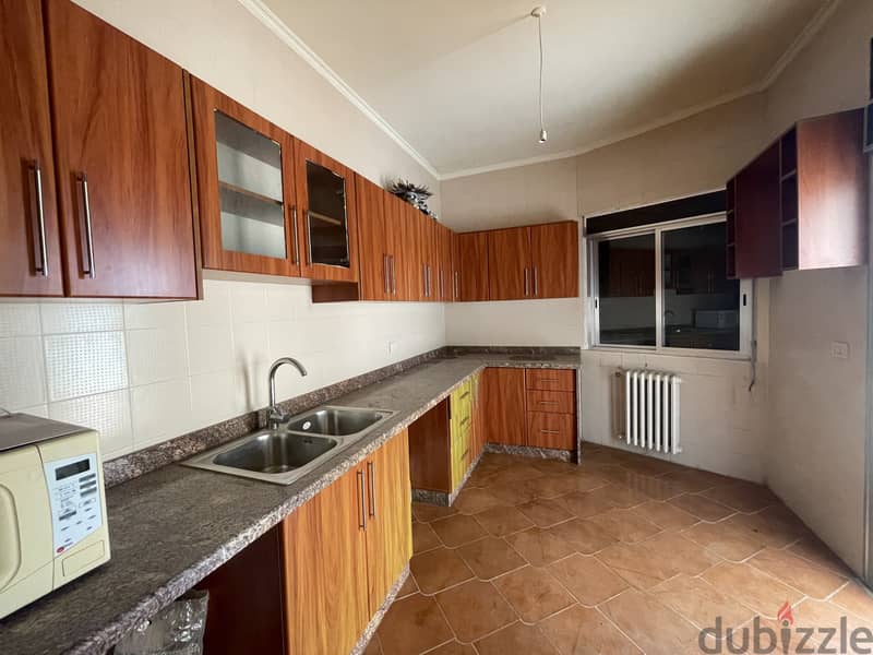 RWK156JS - Apartment For Sale in Ballouneh - شقة للبيع في بلونة 2