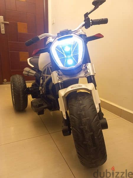 Kids Ride on a 3 wheel Electric Motorbike with LED Light and music 5