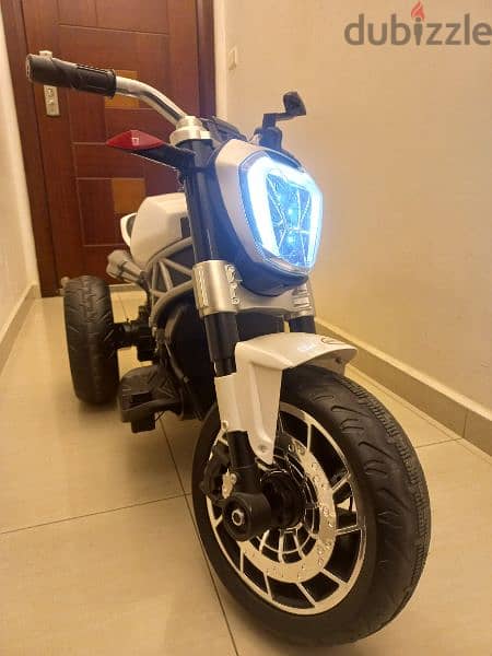 Kids Ride on a 3 wheel Electric Motorbike with LED Light and music 6