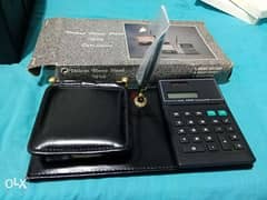 office memo and a calculator. . . plus a pen holder clock radio
