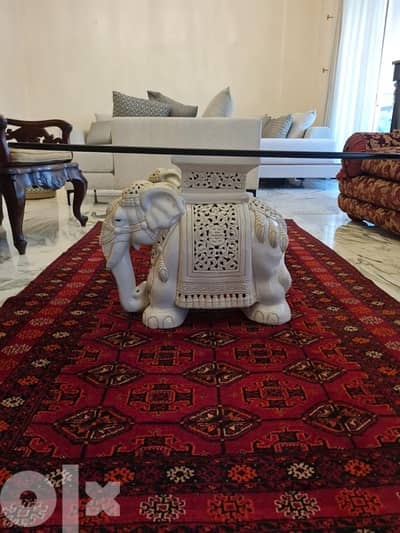 Glass table with elephant table holder