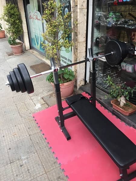 bench adjustable with adjustable rack with axe and weights all new 2