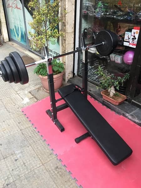 bench adjustable with adjustable rack with axe and weights all new 5