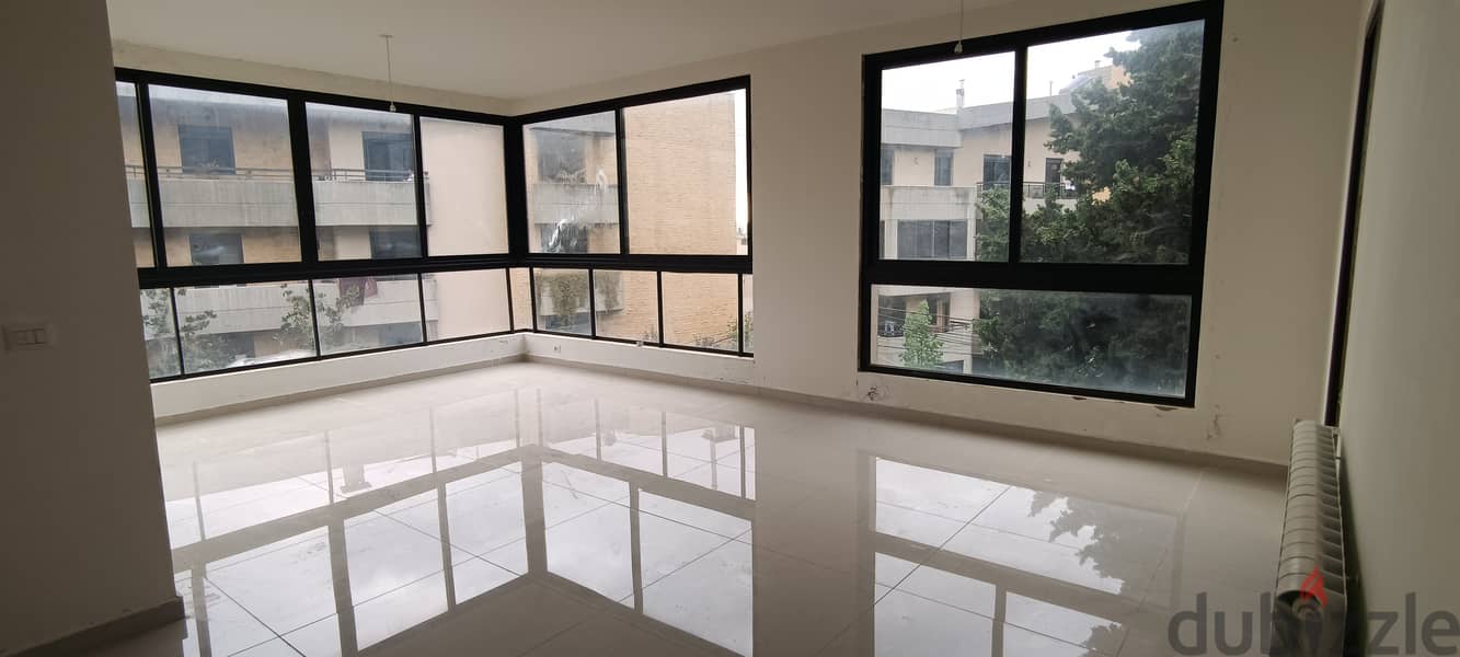 RWK197JS - Apartment For Sale in Ballouneh - شقة للبيع في بلونة 0