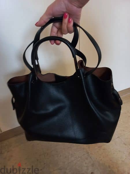 Leather handbag . New collectionجزدان جلد جديد 0