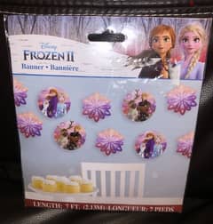 frozen birthday decoration supplies; cupcake toppers and banner/