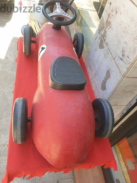 antique car formula 1 made from iron 0