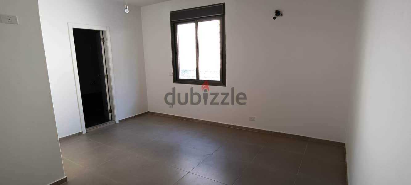 RWK142JS - Apartment For Sale In  Ballouneh - شقة للبيع في بلونة 6