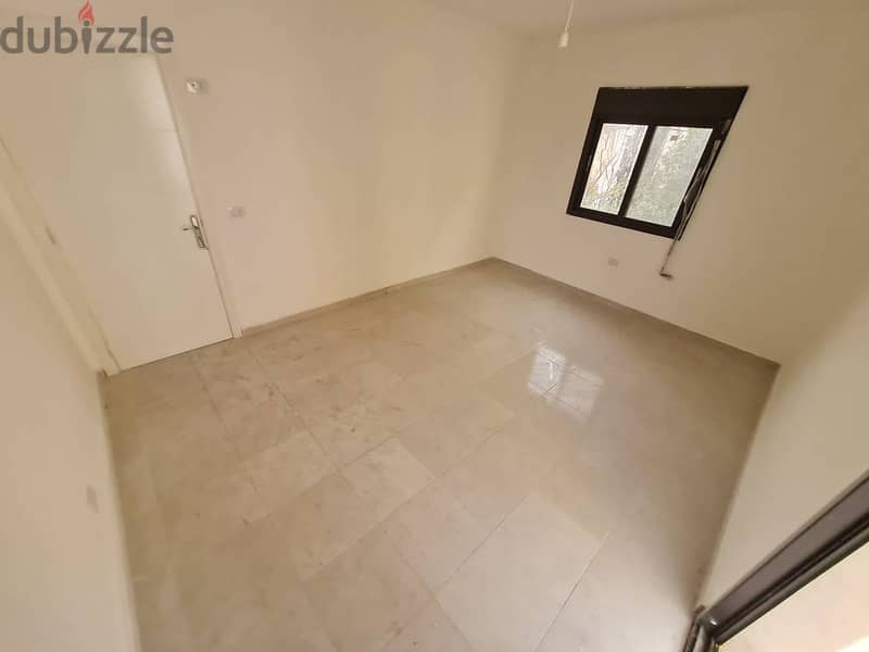 This spacious 195 sqm apartment in Koura Btouratij! REF#NK91085 1