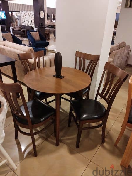 Table and 4 chairs. 0