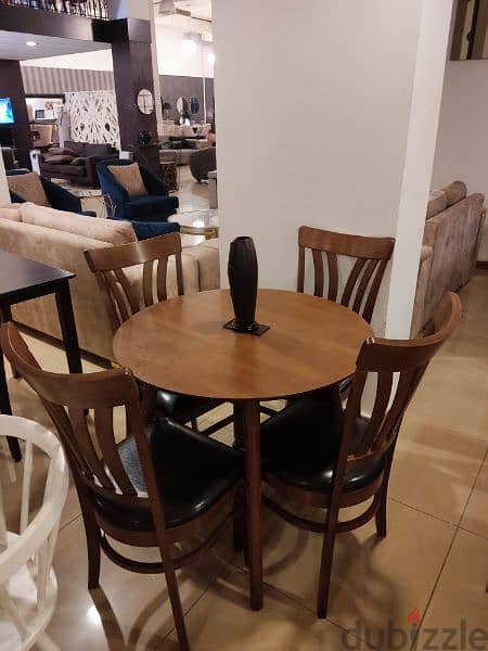 Table and 4 chairs. 1