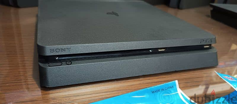 playstation 4 slim European with 2 controller all cable and 2 games 10