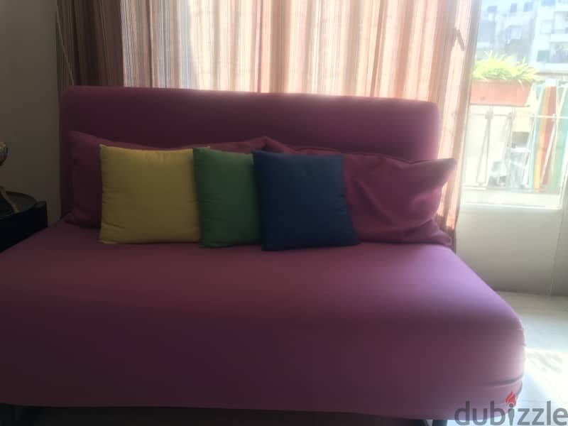 2 Sofa beds like new 1 tea pink, 1 purple + free carpet 2