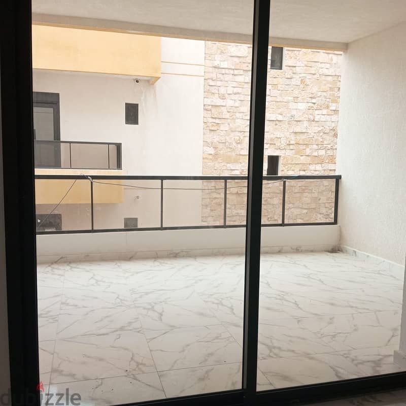 Apartment for sale in Bouar شقة للبيع في البوار 2