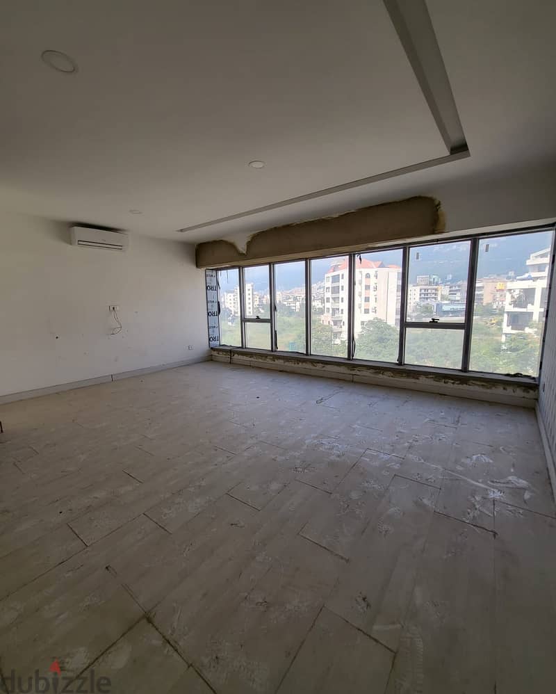 A 55 m2 office having an open mountain view for sale in Kaslik 1