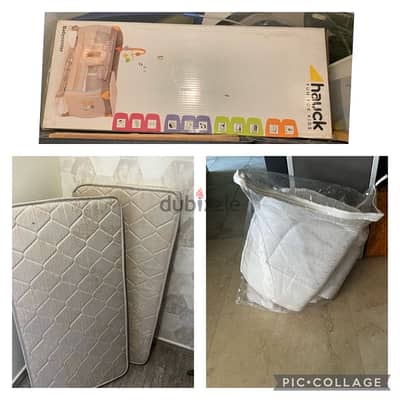 crib with 2 mattresses and bedding covers