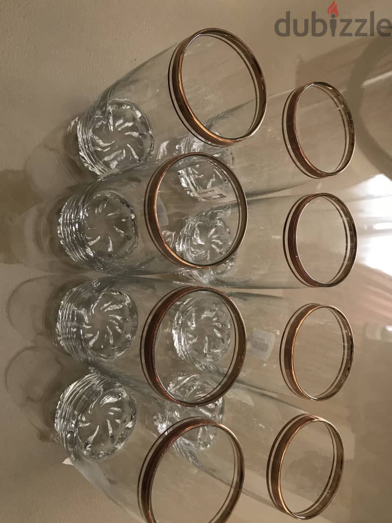 Long glass cups with gold trim. Brand new. 1