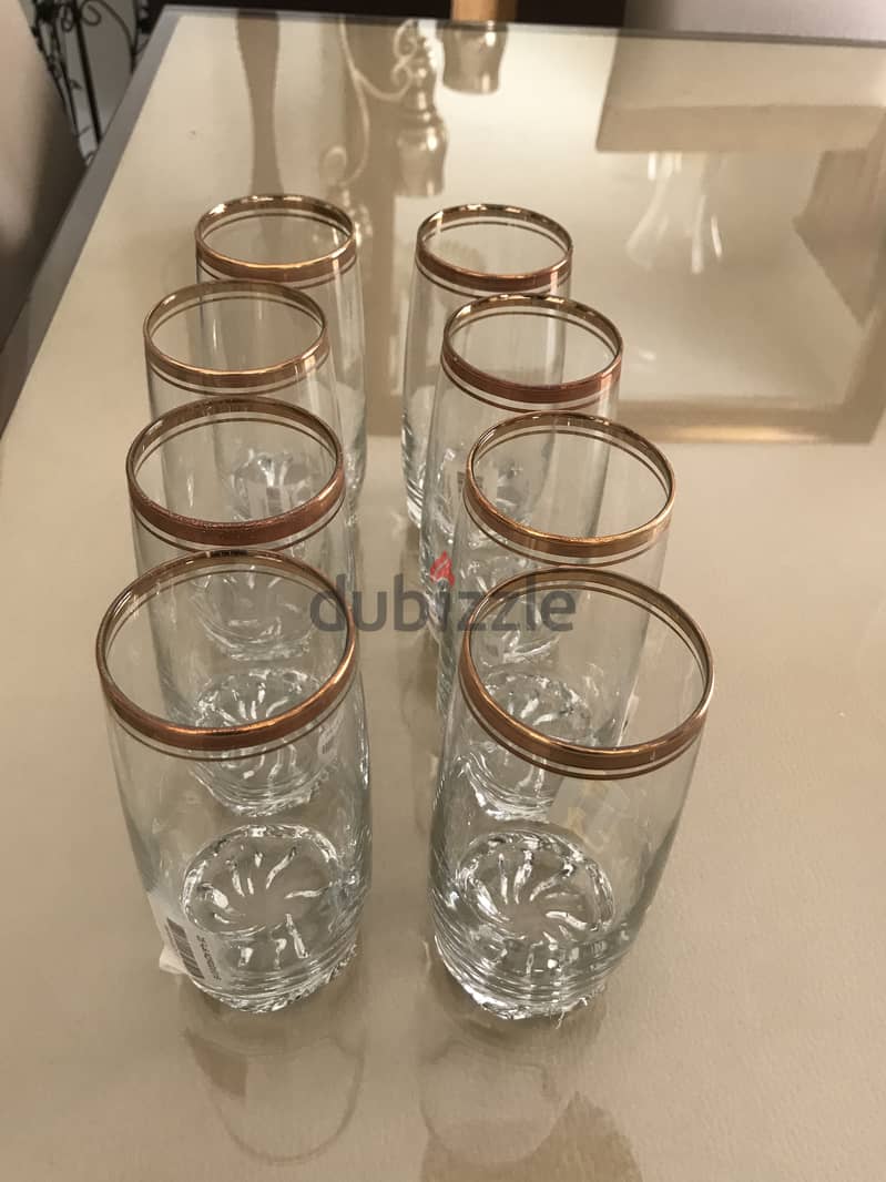 Long glass cups with gold trim. Brand new. 3