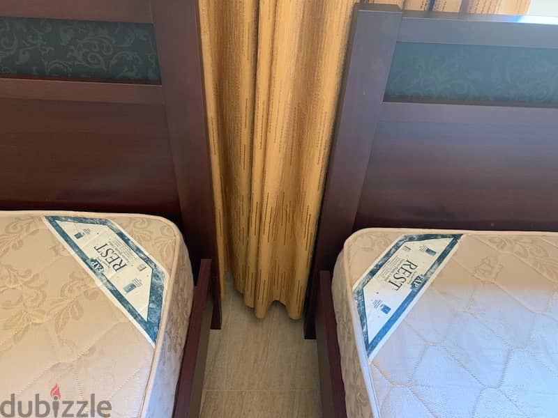 2 single beds with 2 mattresses ( FAB ) 1