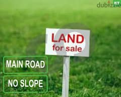 A Land in the main road in ghineh with no slope For sale. REF#BT93489