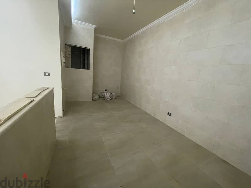 RWK131JS - Apartment For Sale in Ballouneh - شقة للبيع في بلونة 1