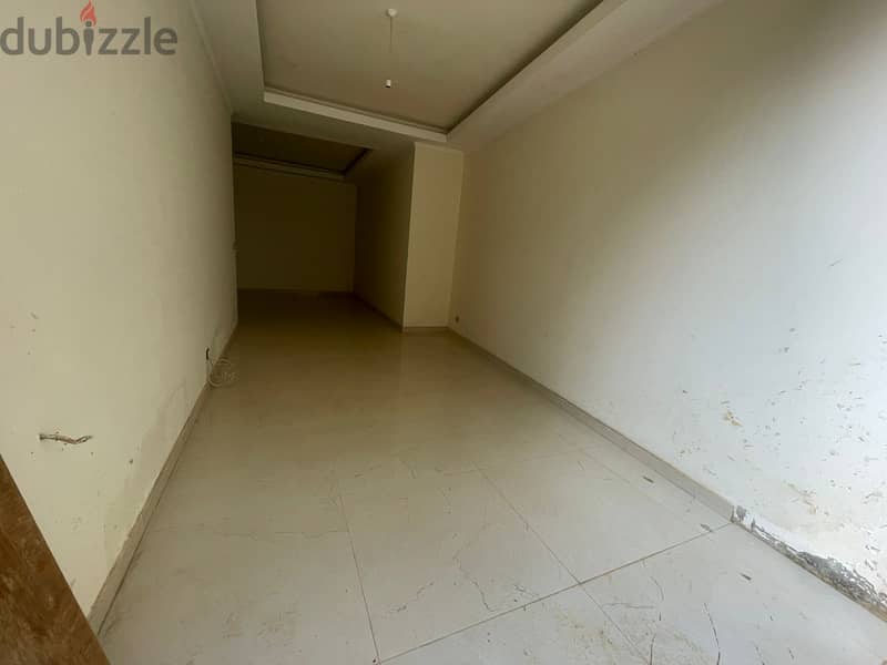 RWK131JS - Apartment For Sale in Ballouneh - شقة للبيع في بلونة 2