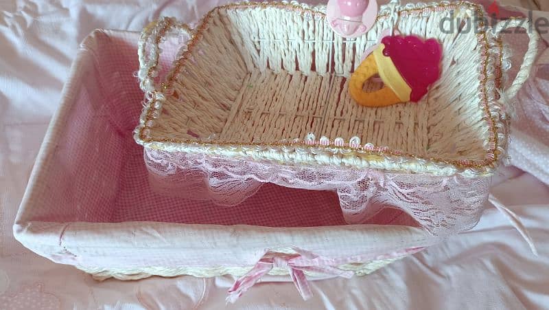 baskets for newborn girls matching with crib cover. 1